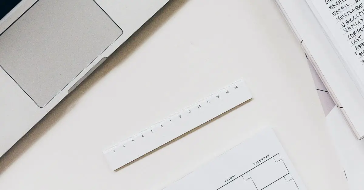 close up of paper and a laptop on a desk
